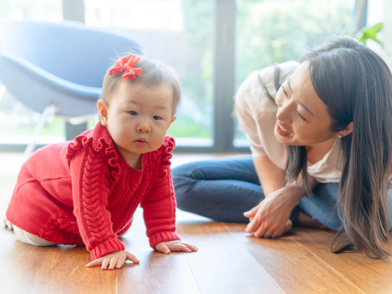 Mother playing with toddler on the floor